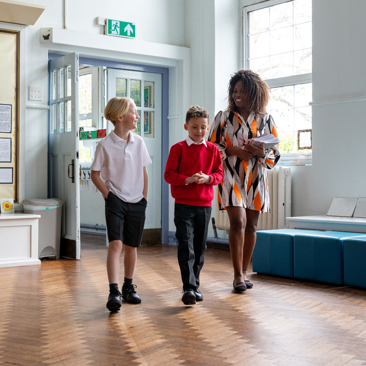 Female teacher walking with students