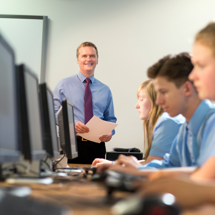 Male teacher in computer room