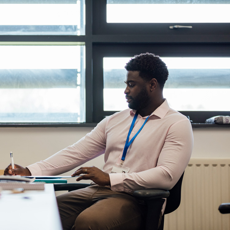 Teacher sitting in office