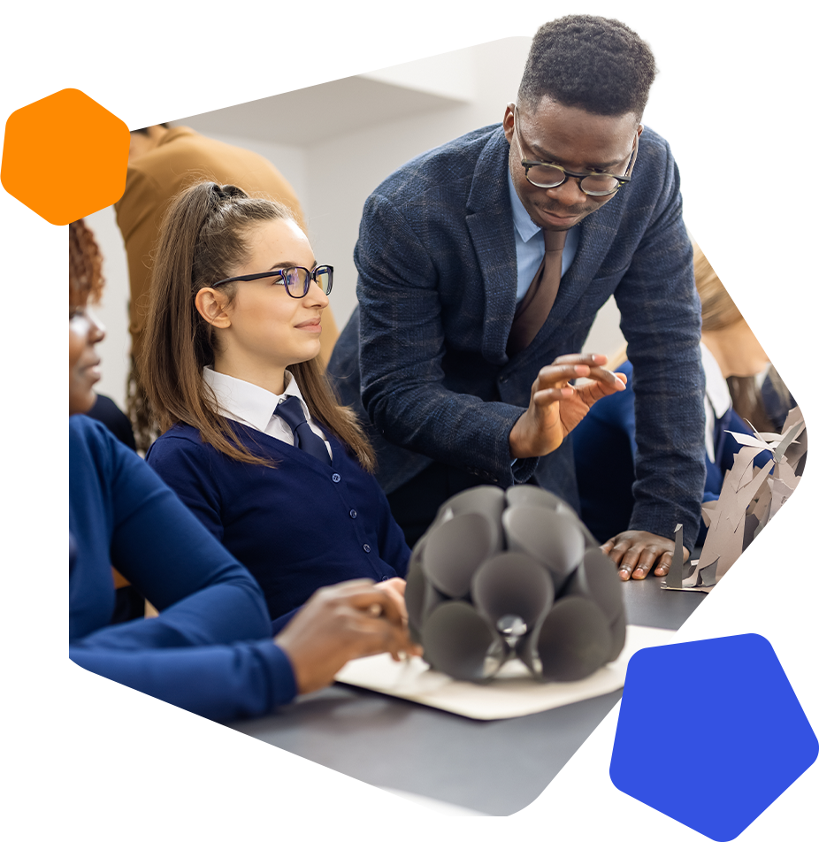 Black male teacher and female students in class