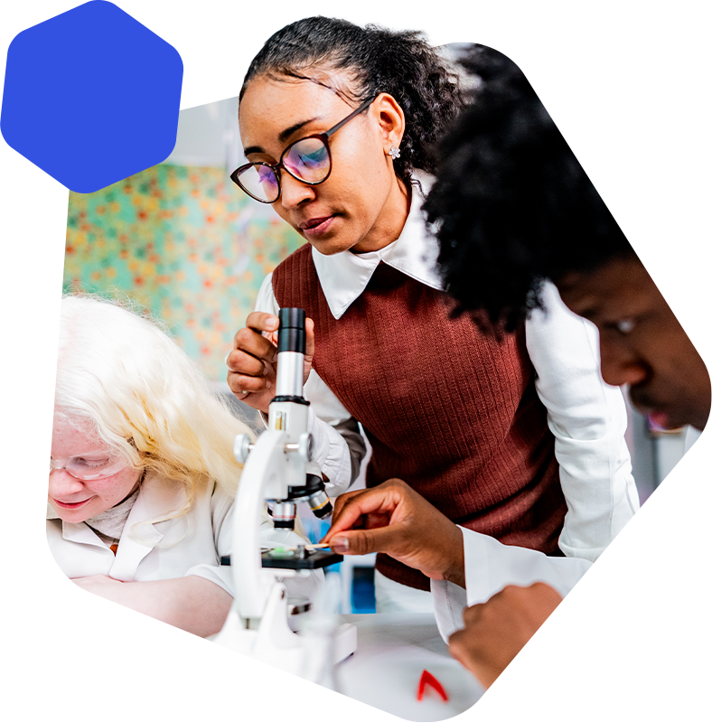 Female teacher using a microscope