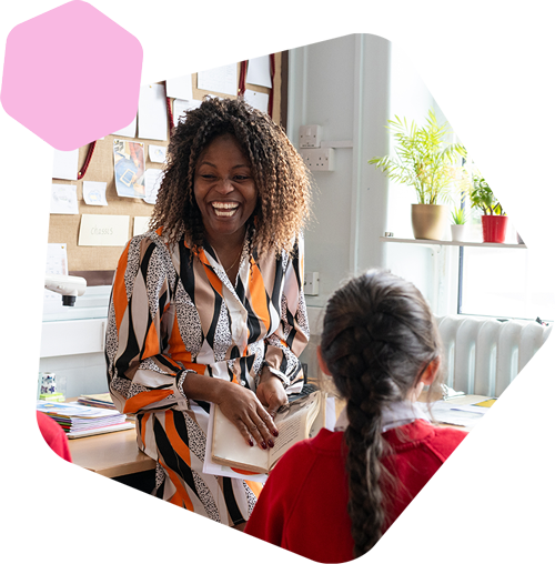 Female teacher laughing in class
