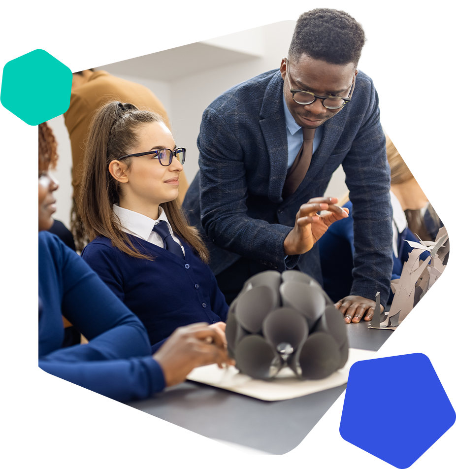 Male teacher and female students in class