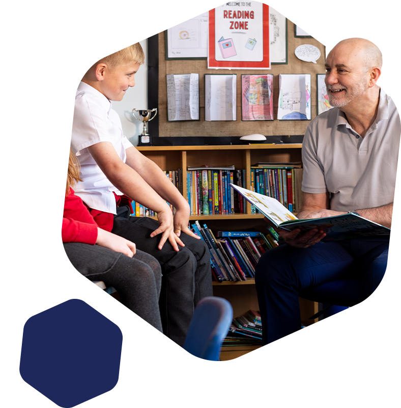 Supply teacher reading to students