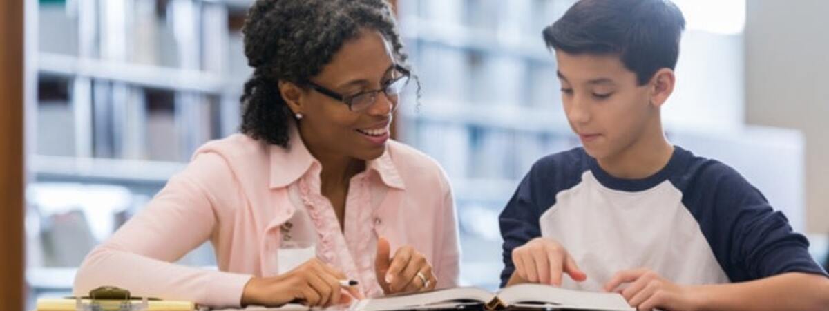 Tutor Working With Middle School Student Picture Id1130407049 (1) Min